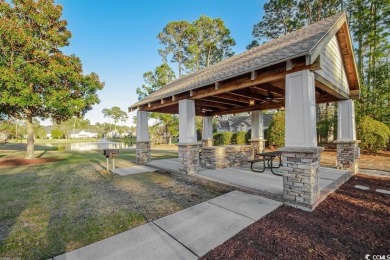 Lush landscaping surrounds this 4-bedroom (One bedroom is on The Founders Club At Pawleys Island in South Carolina - for sale on GolfHomes.com, golf home, golf lot