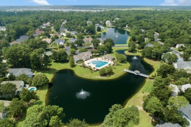 Lush landscaping surrounds this 4-bedroom (One bedroom is on The Founders Club At Pawleys Island in South Carolina - for sale on GolfHomes.com, golf home, golf lot