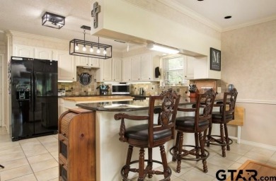 Prepare to be impressed! Nestled behind the private gates of the on Emerald Bay Club in Texas - for sale on GolfHomes.com, golf home, golf lot
