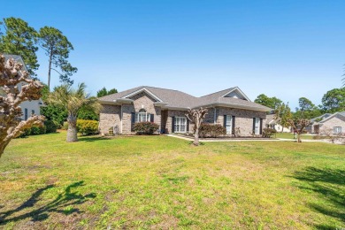 This beautiful 4 bedroom, 2 bath corner lot brick home in Sea on Sea Trail Golf Resort in North Carolina - for sale on GolfHomes.com, golf home, golf lot