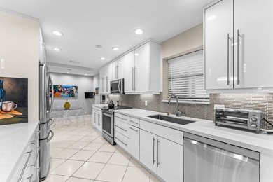 Essex at Hunters Run puts you steps from the clubhouse, dining on Hunters Run Golf and Country Club in Florida - for sale on GolfHomes.com, golf home, golf lot