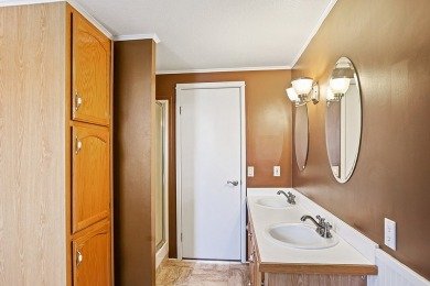 This well-maintained 4-bedroom, 2-bath double wide offers on Bill Roberts Municipal Golf Course in Montana - for sale on GolfHomes.com, golf home, golf lot