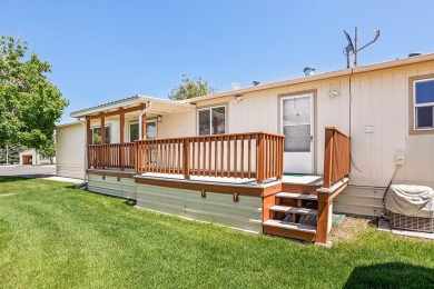 This well-maintained 4-bedroom, 2-bath double wide offers on Bill Roberts Municipal Golf Course in Montana - for sale on GolfHomes.com, golf home, golf lot