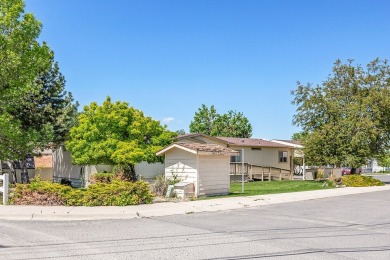 This well-maintained 4-bedroom, 2-bath double wide offers on Bill Roberts Municipal Golf Course in Montana - for sale on GolfHomes.com, golf home, golf lot