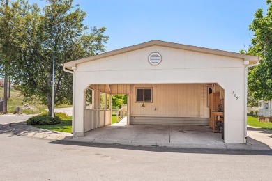 This well-maintained 4-bedroom, 2-bath double wide offers on Bill Roberts Municipal Golf Course in Montana - for sale on GolfHomes.com, golf home, golf lot