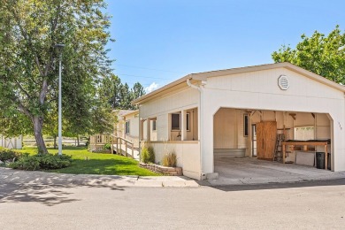 This well-maintained 4-bedroom, 2-bath double wide offers on Bill Roberts Municipal Golf Course in Montana - for sale on GolfHomes.com, golf home, golf lot