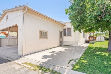 This well-maintained 4-bedroom, 2-bath double wide offers on Bill Roberts Municipal Golf Course in Montana - for sale on GolfHomes.com, golf home, golf lot