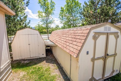 This well-maintained 4-bedroom, 2-bath double wide offers on Bill Roberts Municipal Golf Course in Montana - for sale on GolfHomes.com, golf home, golf lot