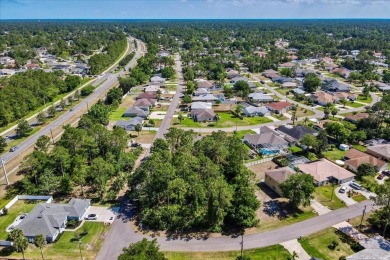 Build your dream home on this beautiful vacant lot in the on The Grand Club - Pine Lakes Course in Florida - for sale on GolfHomes.com, golf home, golf lot
