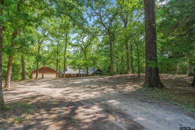 Secluded 3 bedroom 2 bath home surrounded on all 4 sides by on Holly Lake Ranch Golf Club in Texas - for sale on GolfHomes.com, golf home, golf lot