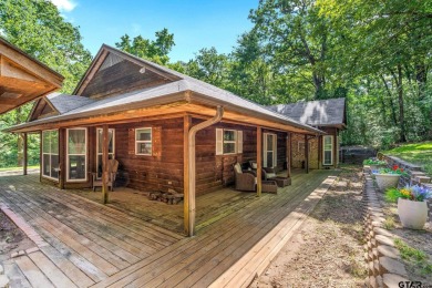 Secluded 3 bedroom 2 bath home surrounded on all 4 sides by on Holly Lake Ranch Golf Club in Texas - for sale on GolfHomes.com, golf home, golf lot