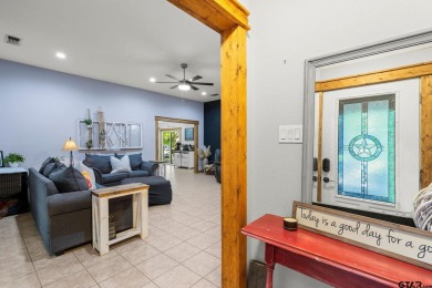 Secluded 3 bedroom 2 bath home surrounded on all 4 sides by on Holly Lake Ranch Golf Club in Texas - for sale on GolfHomes.com, golf home, golf lot