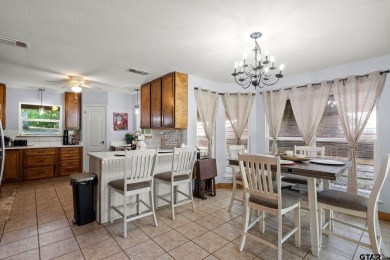 Secluded 3 bedroom 2 bath home surrounded on all 4 sides by on Holly Lake Ranch Golf Club in Texas - for sale on GolfHomes.com, golf home, golf lot