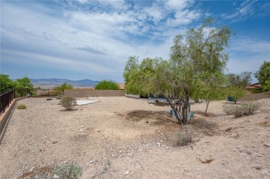Spacious Living & Endless Possibilities in Laughlin Ranch on Laughlin Ranch Golf Club in Arizona - for sale on GolfHomes.com, golf home, golf lot