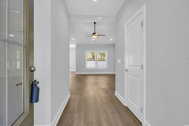 This cottage style home offers three bedrooms and two fully on Beachwood Golf Club in South Carolina - for sale on GolfHomes.com, golf home, golf lot