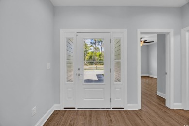 This cottage style home offers three bedrooms and two fully on Beachwood Golf Club in South Carolina - for sale on GolfHomes.com, golf home, golf lot