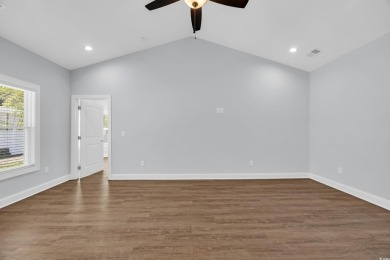 This cottage style home offers three bedrooms and two fully on Beachwood Golf Club in South Carolina - for sale on GolfHomes.com, golf home, golf lot