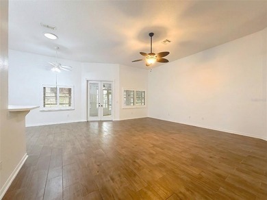 Welcome to this beautifully maintained 3-bedroom, 2-bath home on Lakes of Lady Lake Golf Course in Florida - for sale on GolfHomes.com, golf home, golf lot