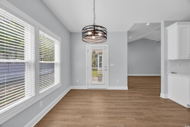 This cottage style home offers three bedrooms and two fully on Beachwood Golf Club in South Carolina - for sale on GolfHomes.com, golf home, golf lot