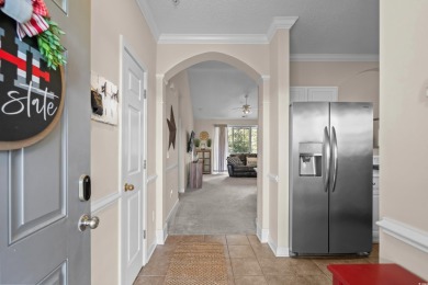 Welcome to this charming 2 bedroom, 2 bathroom top-floor condo on Barefoot Resort and Golf Club  in South Carolina - for sale on GolfHomes.com, golf home, golf lot