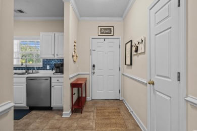Welcome to this charming 2 bedroom, 2 bathroom top-floor condo on Barefoot Resort and Golf Club  in South Carolina - for sale on GolfHomes.com, golf home, golf lot