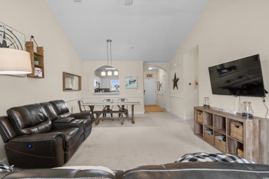 Welcome to this charming 2 bedroom, 2 bathroom top-floor condo on Barefoot Resort and Golf Club  in South Carolina - for sale on GolfHomes.com, golf home, golf lot