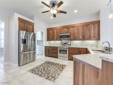 Lakefront, golf view, total storm protection, plus a 2-car on Crown Colony Golf and Country Club in Florida - for sale on GolfHomes.com, golf home, golf lot