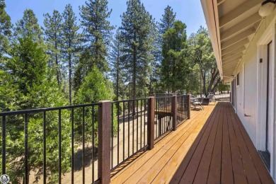 Enjoy serene views of the ridgeline through the pines and cedars on Pine Mountain Lake Country Club in California - for sale on GolfHomes.com, golf home, golf lot