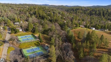 Enjoy serene views of the ridgeline through the pines and cedars on Pine Mountain Lake Country Club in California - for sale on GolfHomes.com, golf home, golf lot