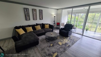 Experience South Florida living in this beautifully renovated on Palm-Aire Country Club and Resort - Palms in Florida - for sale on GolfHomes.com, golf home, golf lot