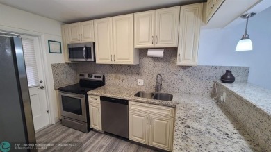 Experience South Florida living in this beautifully renovated on Palm-Aire Country Club and Resort - Palms in Florida - for sale on GolfHomes.com, golf home, golf lot