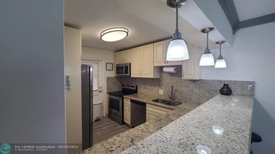 Experience South Florida living in this beautifully renovated on Palm-Aire Country Club and Resort - Palms in Florida - for sale on GolfHomes.com, golf home, golf lot