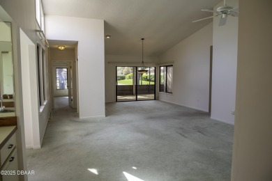 A 2 Bedroom with a Den/2 Bath end unit in the Woodside on Spruce Creek Golf Club in Florida - for sale on GolfHomes.com, golf home, golf lot