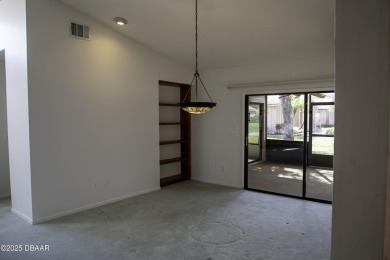 A 2 Bedroom with a Den/2 Bath end unit in the Woodside on Spruce Creek Golf Club in Florida - for sale on GolfHomes.com, golf home, golf lot