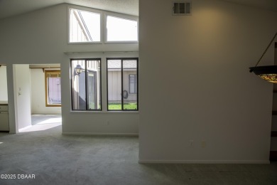 A 2 Bedroom with a Den/2 Bath end unit in the Woodside on Spruce Creek Golf Club in Florida - for sale on GolfHomes.com, golf home, golf lot