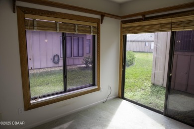 A 2 Bedroom with a Den/2 Bath end unit in the Woodside on Spruce Creek Golf Club in Florida - for sale on GolfHomes.com, golf home, golf lot