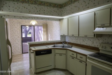A 2 Bedroom with a Den/2 Bath end unit in the Woodside on Spruce Creek Golf Club in Florida - for sale on GolfHomes.com, golf home, golf lot