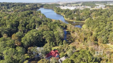 This beautifully updated home, with potential for four bedrooms on Lake Forest Yacht and Country Club in Alabama - for sale on GolfHomes.com, golf home, golf lot