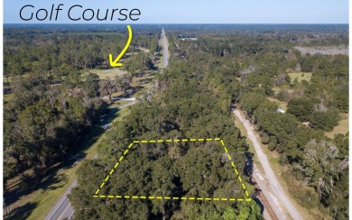 Nice wooded lot located right on Hwy 90 between Live Oak and on Suwannee Country Club in Florida - for sale on GolfHomes.com, golf home, golf lot