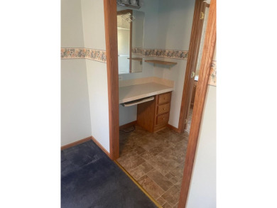 Don't miss your chance for this 2 bedroom, 2 bath mobile home on Rhinelander Country Club in Wisconsin - for sale on GolfHomes.com, golf home, golf lot