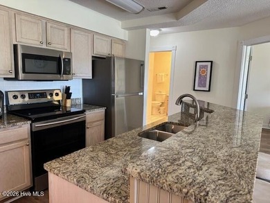 Spacious, fully furnished 2BR/2BA second-floor center-unit condo on Brunswick Plantation and Golf Resorts in North Carolina - for sale on GolfHomes.com, golf home, golf lot