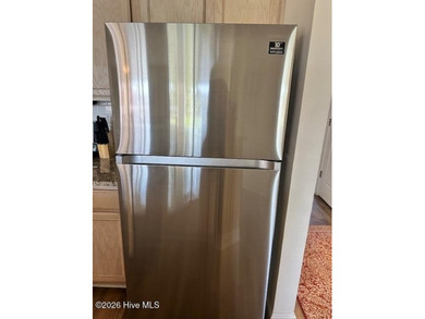 Spacious, fully furnished 2BR/2BA second-floor center-unit condo on Brunswick Plantation and Golf Resorts in North Carolina - for sale on GolfHomes.com, golf home, golf lot