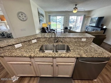 Spacious, fully furnished 2BR/2BA second-floor center-unit condo on Brunswick Plantation and Golf Resorts in North Carolina - for sale on GolfHomes.com, golf home, golf lot