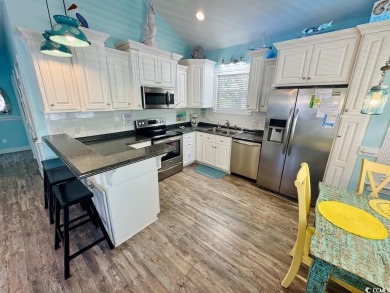 NEW LISTING! STUNNING 3 BED/2 BATH RAISED BEACH HOUSE WITH TONS on Prestwick Country Club in South Carolina - for sale on GolfHomes.com, golf home, golf lot