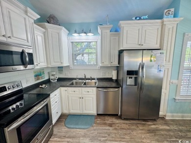 NEW LISTING! STUNNING 3 BED/2 BATH RAISED BEACH HOUSE WITH TONS on Prestwick Country Club in South Carolina - for sale on GolfHomes.com, golf home, golf lot