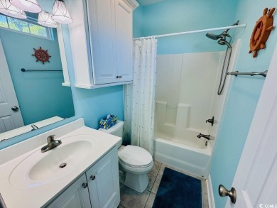 NEW LISTING! STUNNING 3 BED/2 BATH RAISED BEACH HOUSE WITH TONS on Prestwick Country Club in South Carolina - for sale on GolfHomes.com, golf home, golf lot