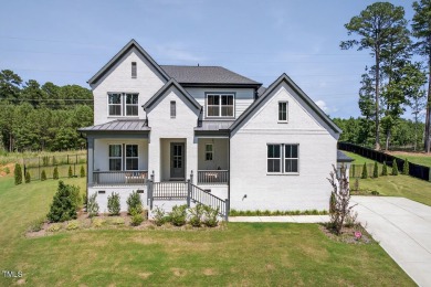 Situated atop a spacious corner lot in Hasentree, this on Hasentree Club in North Carolina - for sale on GolfHomes.com, golf home, golf lot