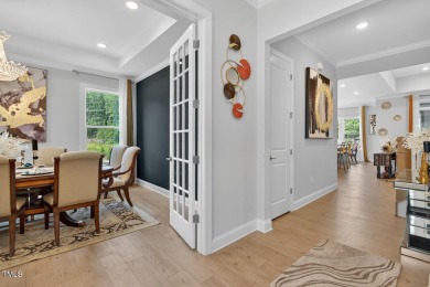Situated atop a spacious corner lot in Hasentree, this on Hasentree Club in North Carolina - for sale on GolfHomes.com, golf home, golf lot