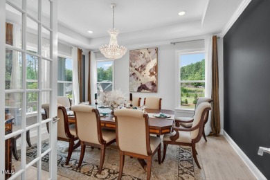 Situated atop a spacious corner lot in Hasentree, this on Hasentree Club in North Carolina - for sale on GolfHomes.com, golf home, golf lot