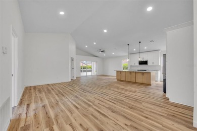 Welcome to this beautifully updated home in the sought-after on Kings Ridge Golf Club in Florida - for sale on GolfHomes.com, golf home, golf lot